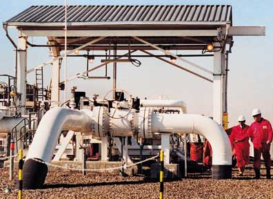 BTC Photo - Pipelines emerge from the ground at pumping stations, where access is provided for devices which travel through the line for maintenance and inspection.