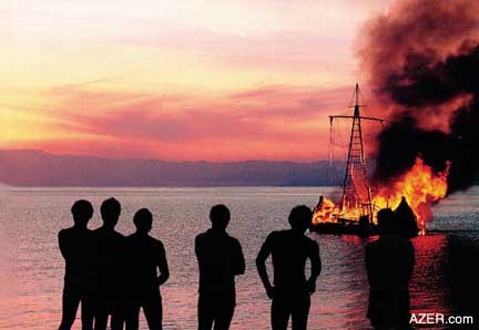 Thor Heyerdahl (center) and his 10-man crew burn their reed ship Tigris in protest of the wars raging in the Middle East. (Photo by Kon-Tiki Museum, Oslo)